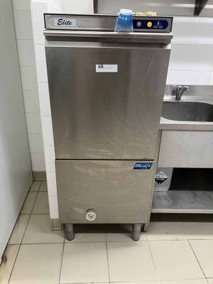 a stainless steel dishwasher sitting in a kitchen next to a sink