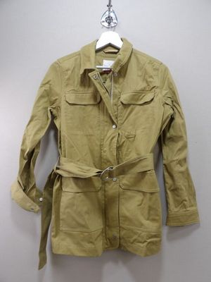 an image of a jacket hanging on a hanger on a wall