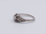 a white gold ring set with a round brilliant cut diamond