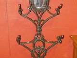 a clock on a stand in the corner of a room