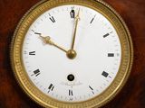 a clock with roman numerals on the face of it