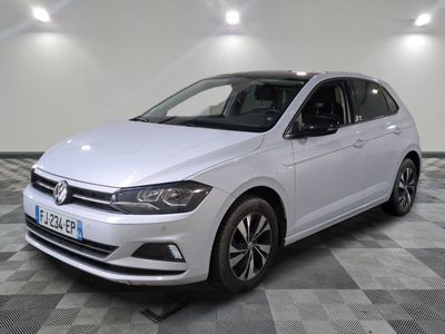 the white volkswagen vw golf is parked on a checkered floor