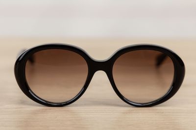 a close up of a pair of sunglasses on a table