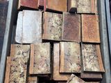 a box full of old books sitting on a table