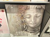 a picture of a picture of a buddha on a shelf