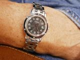 a man that is wearing a watch on his wrist
