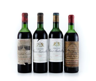 trois bouteilles de vin sont alignées sur une surface blanche