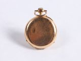 an image of a gold pocket watch sitting on a white surface