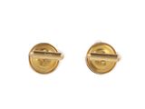 a pair of gold plated cufflinks with a single button