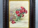 painting of red roses in a glass vase on a table
