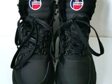 pair of black shoes with a pepsi logo on the side