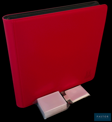 a red binder with a keyboard attached to it