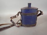 a small blue bucket with a brown strap on it