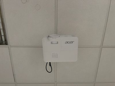 a white box attached to the ceiling of a bathroom