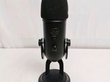 a close up of a microphone on a stand with a white background
