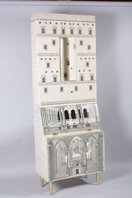 a tall white cabinet with a clock on top of it