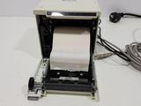 an image of a printer with a roll of paper in it