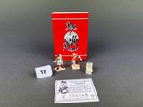 a red box with some small figurines on it