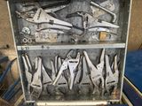 many tools in a metal case on a table