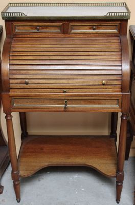 a small wooden desk with a glass top on it