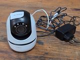 a camera that is sitting on a table next to a charger