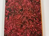 an image of a red and black painting on a white surface
