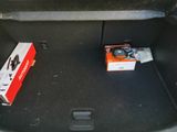 a box of soda sitting in the trunk of a car