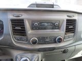 a dashboard of a car with a clock and a radio
