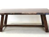 an image of a wooden bench in a room