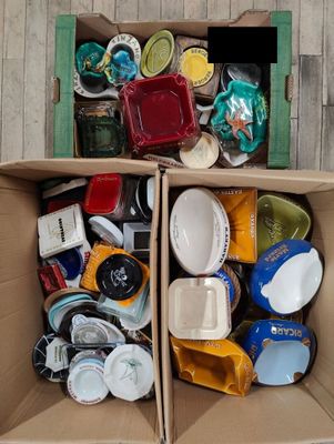 a cardboard box filled with assorted items on the floor