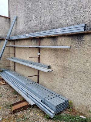 a bench that is leaning against a wall