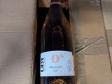 a bottle of wine in a cardboard box on the floor
