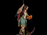 the statue of a man with a sword and a flower in his hand