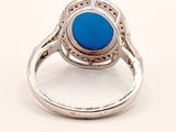 sterling silver ring with a blue stone in the center