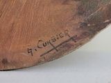 a piece of wood that has writing on it