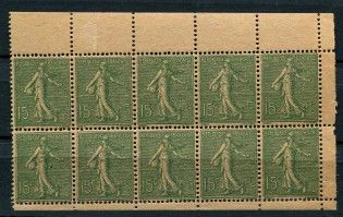 a green stamp with a picture of a man and a woman on it