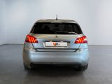 a silver car that is parked in a room