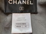 the label on a chanel jacket is attached to the back of the jacket