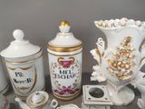 a lot of white and gold items on a table