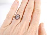 an image of a woman ' s hand with a ring on it