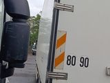 a truck that is parked next to another truck