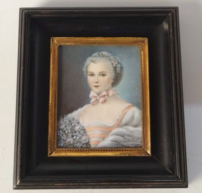 portrait of a woman in a white dress with a pink bow in a black frame