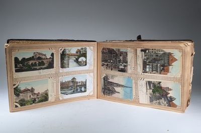an open book with pictures of buildings and bridges on it