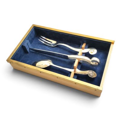 four forks and spoons in a box on a table