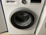 a washer and a dryer in a small room