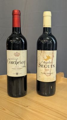 two bottles of wine sitting on a wooden table