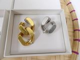 two rings that are in a box on a table