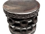 a wooden stool that has a wooden top on it