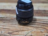 a camera lens sitting on top of a wooden table