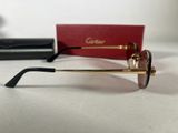 cartier sunglasses with box and case on a white surface